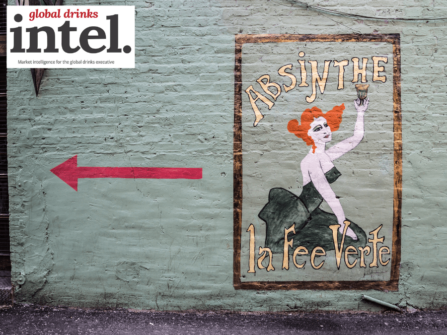 Painted sign for Absinthe La Fee Verte on wall