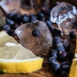 Juniper berries with ice and lemon
