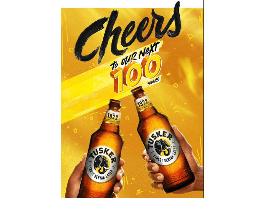 Tusker bottles on 100th anniversary poster for East African Breweries
