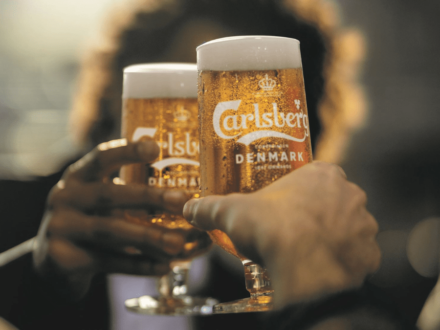 Two branded glasses of Carlsberg