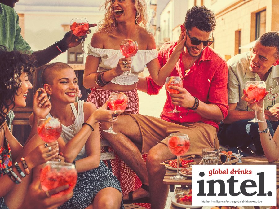 Consumers drinking Martini vermouth cocktails in the sunshine