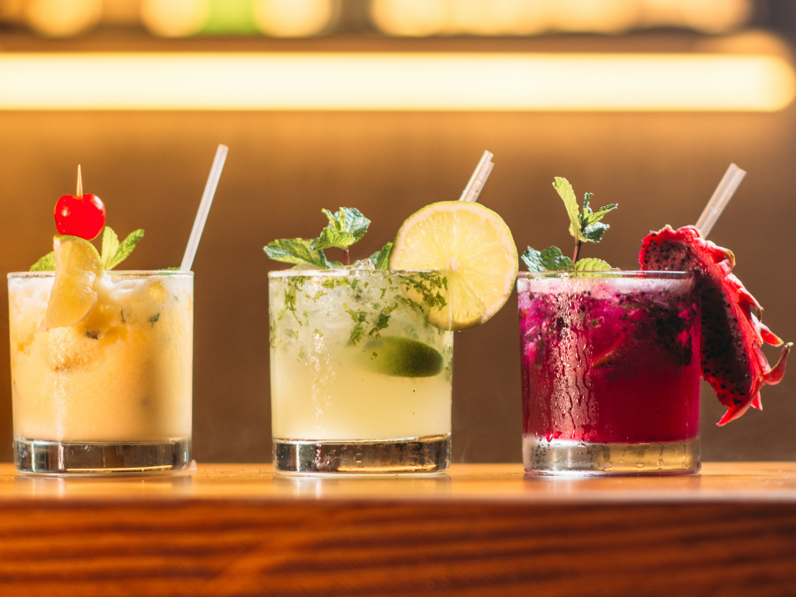 Three cocktails on a bar