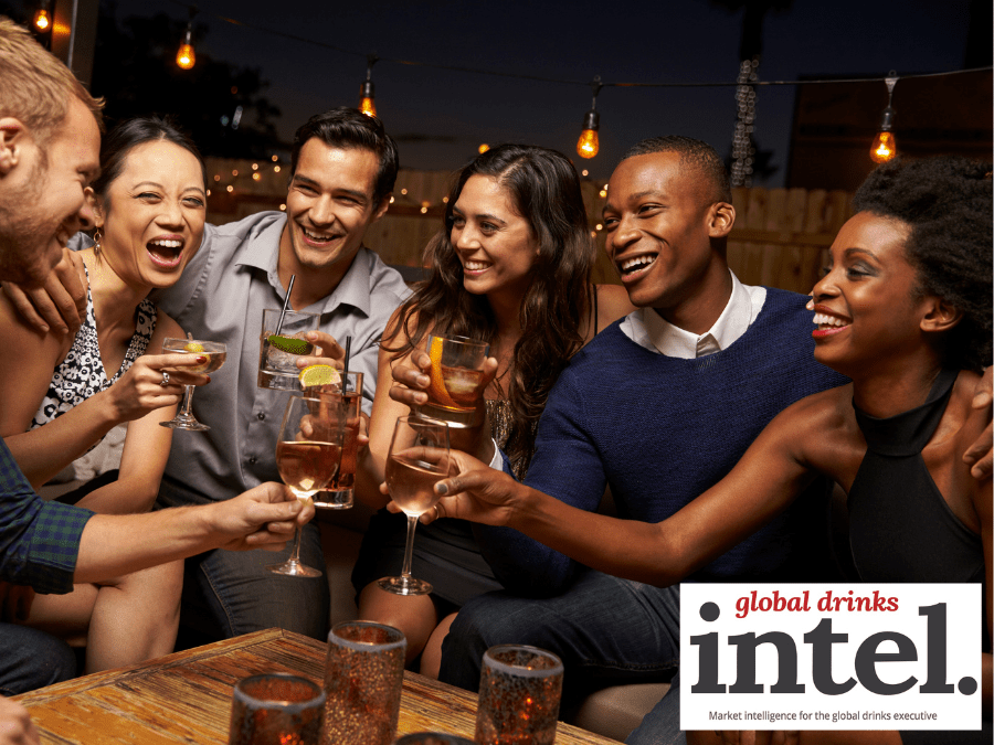 Younger LDA consumers toasting each other in a bar