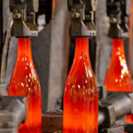 Glass bottles just out of the furnace