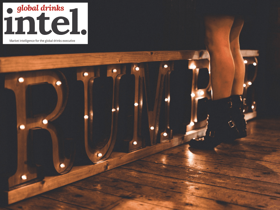 Rumble sign on floor with woman standing in front of it