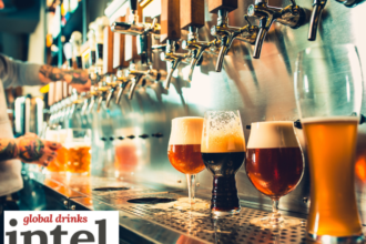 A row of beer taps in a bar with four different beers