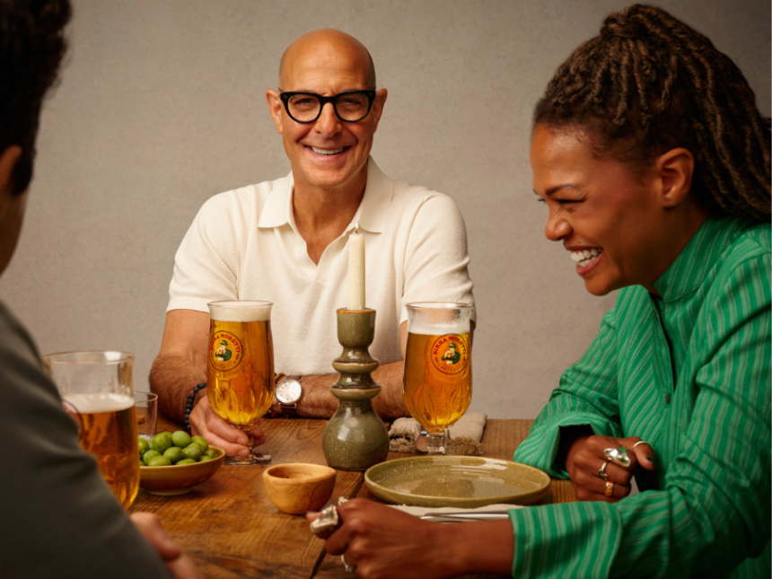 Stanley Tucci with a Birra Moretti branded glass