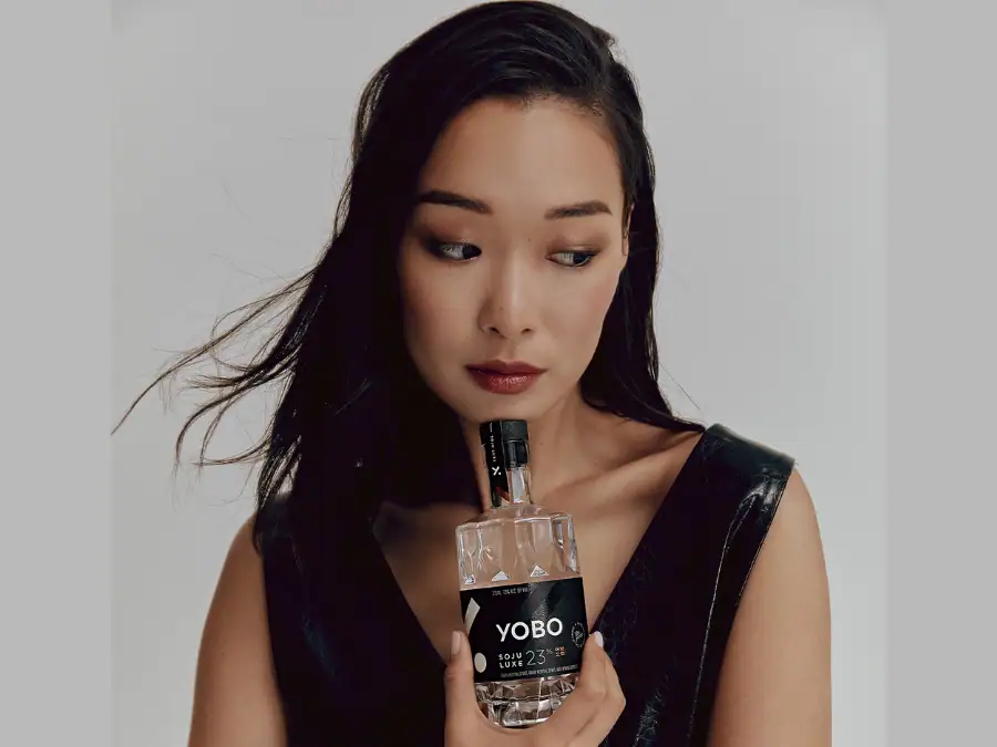 Female with bottle of Yobo soju