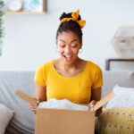 A woman opening a box
