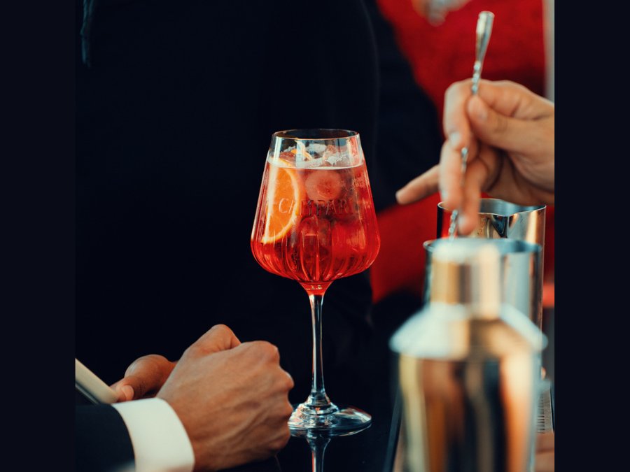 Campari-branded glass on a bar