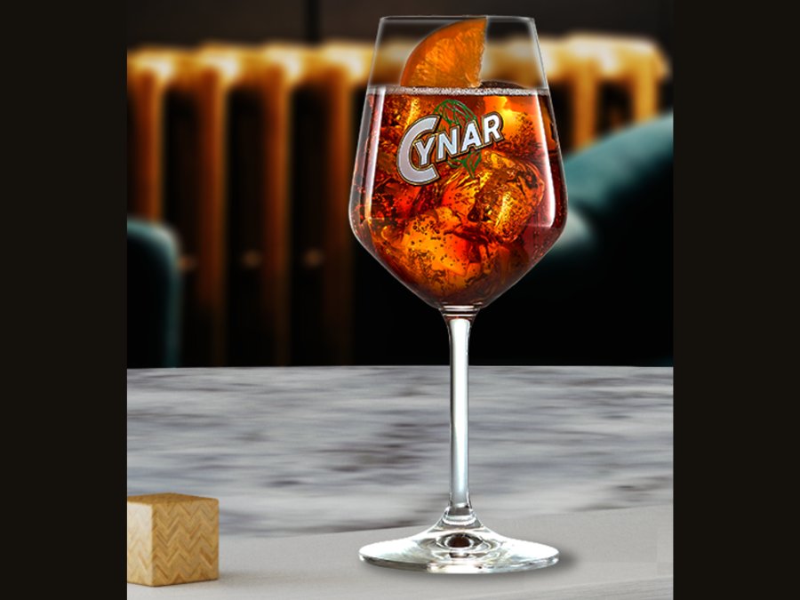 Cynar-branded glass on a bar