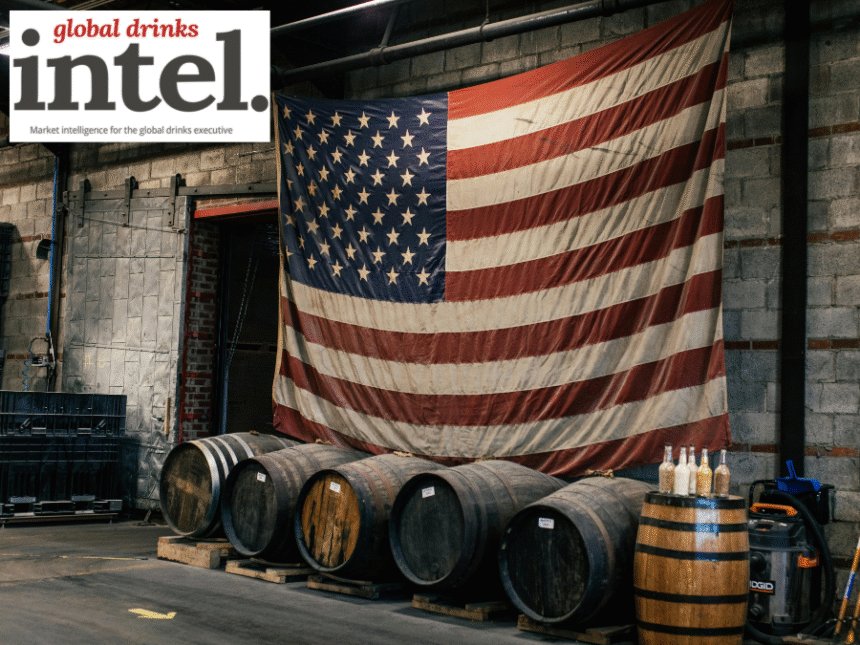American flag above row of barrels in warehouse