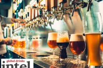 A row of beer taps in a bar with four different beers