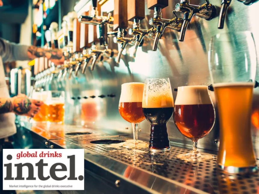 A row of beer taps in a bar with four different beers