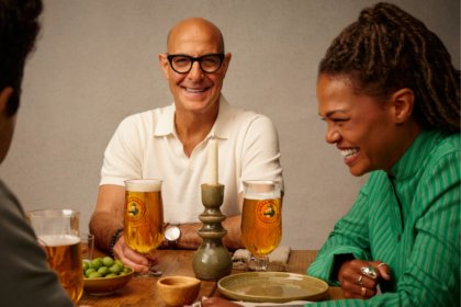 Stanley Tucci with a Birra Moretti branded glass