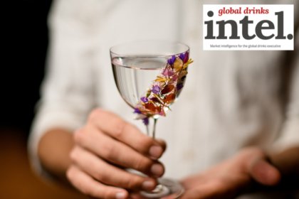 Spirit serve in glass with floral garnish