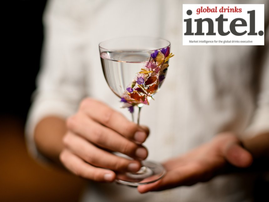 Spirit serve in glass with floral garnish