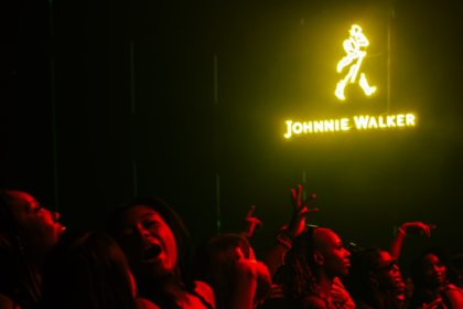 Johnnie Walker logo on wall of entertainment venue