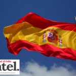 Spanish flag against blue sky background