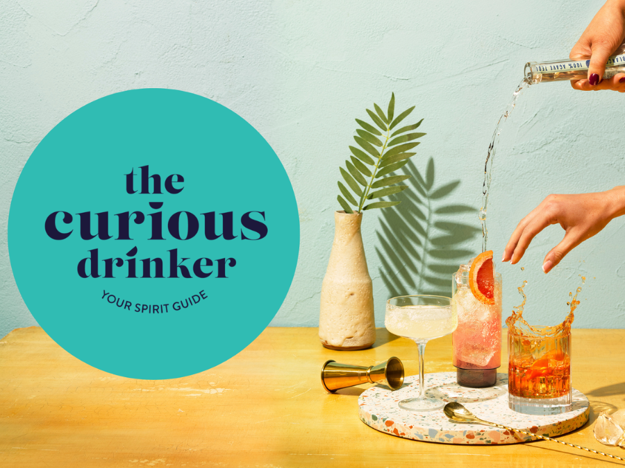 The Curious Drinker logo with bottle of spirits
