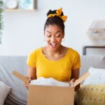 A woman opening a box
