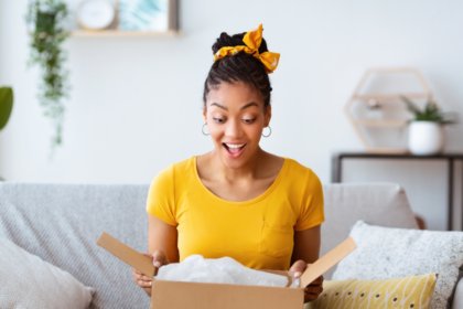 A woman opening a box