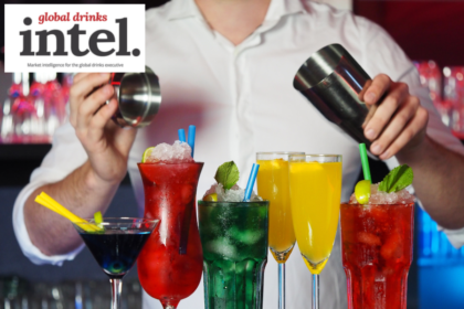 A cocktail being prepared on a bar