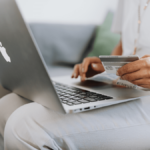 Close-up of laptop and a credit card