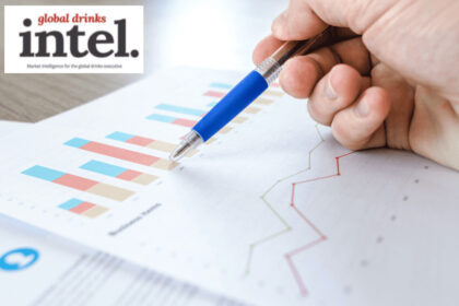 A pen pointing at a graph on a sheet of paper