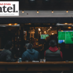 View into an on-premise venue showing sport on a television