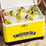 Cans of Twisted Tea in a branded cooler