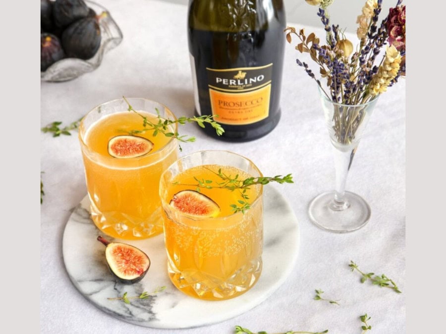 Bottle of Perlino prosecco with two drinks serves