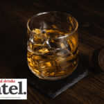 A glass of whisky/whiskey over ice