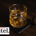 A glass of whisky/whiskey over ice