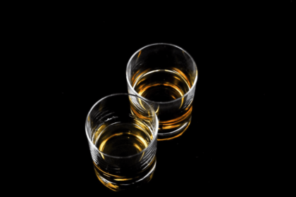 Two glasses containing aged spirit