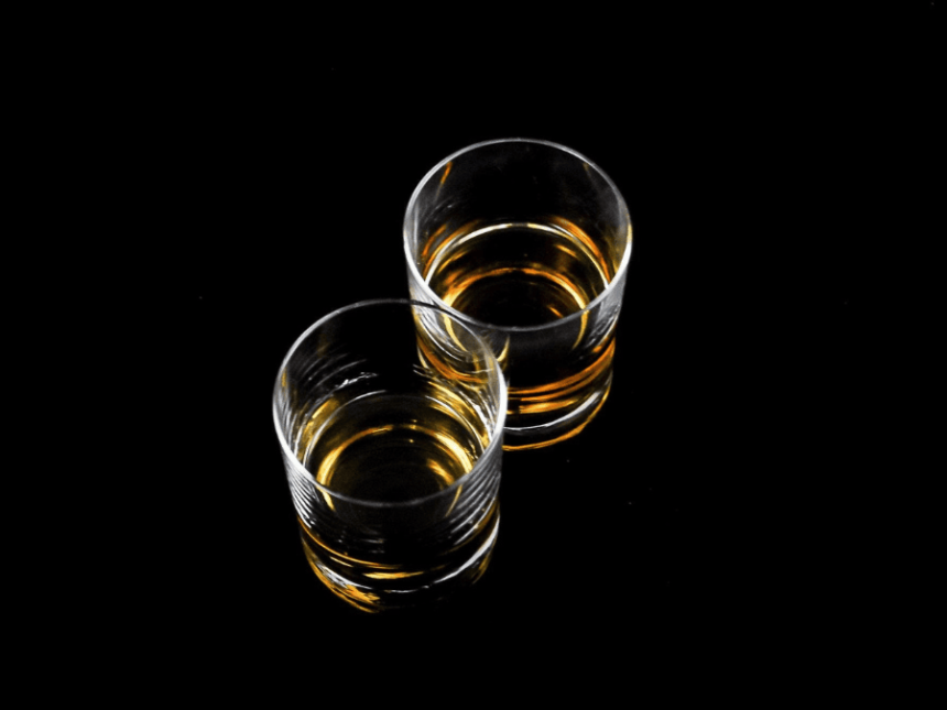 Two glasses containing aged spirit