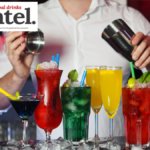 A cocktail being prepared on a bar