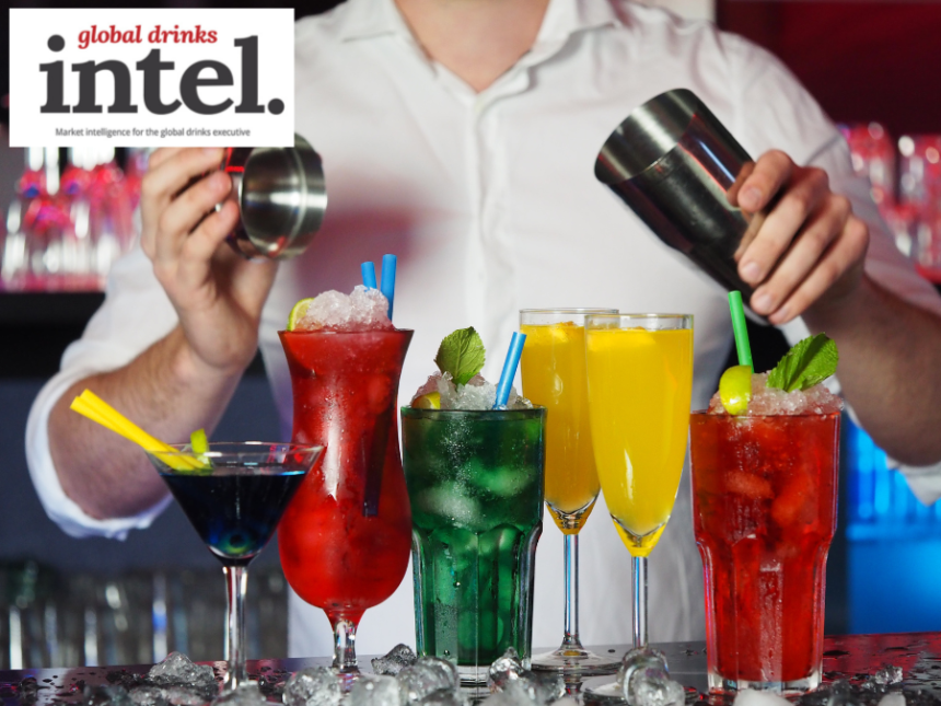 A cocktail being prepared on a bar
