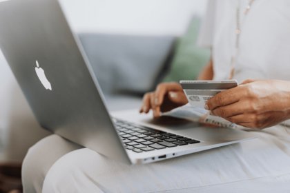 Close-up of laptop and a credit card