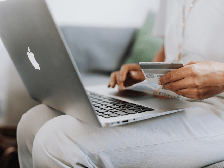 Close-up of laptop and a credit card