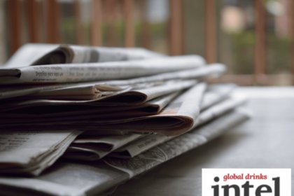 A pile of newspapers on a table