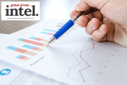 A pen pointing at a graph on a sheet of paper