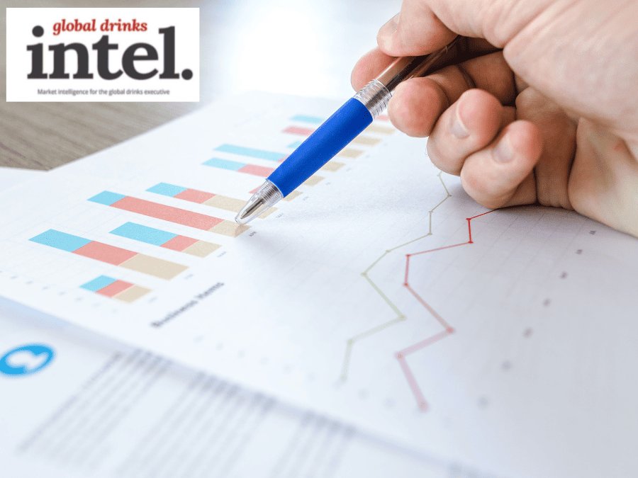 A pen pointing at a graph on a sheet of paper