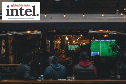 View into an on-premise venue showing sport on a television