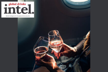 Two glasses of champagne up-close on an aeroplane with Global Drinks Intel logo