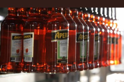 Aperol bottles on a production line