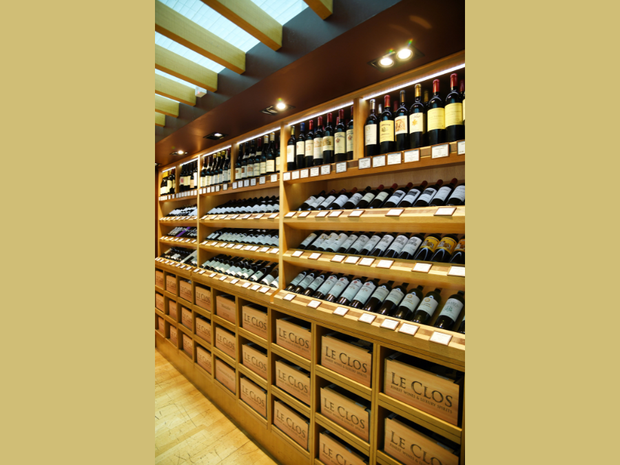 Display shelves containing wine at wine & spirits retailer Le Clos