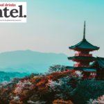 Landscape of Japan, featuring a pagoda and trees in blossom
