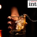 A glass of whisky/whiskey with ice