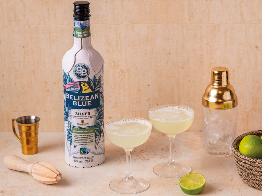Bottle of Belizean Blue Silver rum with cocktail serve